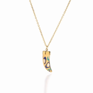 Macro detail of 18K gold-plated cornicello pendant with vibrant enamel swirl patterns