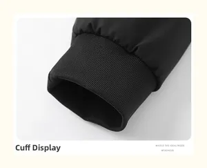 Close-up of elastic ribbed cuffs on a black jacket showing windproof knit texture