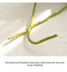 Detail of flexible green faux peony stem with internal wire for adjustable styling