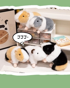 Detail of five colorful guinea pig plush toys with realistic soft fur on a white shelf