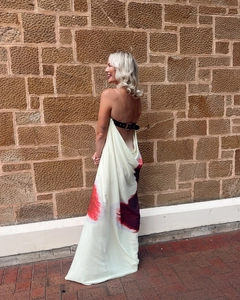 Detail of backless strapless maxi dress with abstract print and buckled leather strap