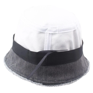 Detail of frayed edge denim brim and white canvas crown on a casual bucket hat