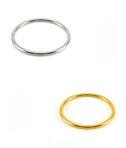 Close-up of polished gold and silver stainless steel bangles with eco-friendly plating