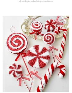 Macro shot of glittery red and white Christmas candy cane decorations on a gold tray