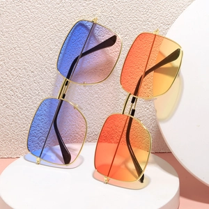 Vintage square metal sunglasses with gradient lenses on minimalist geometric podium