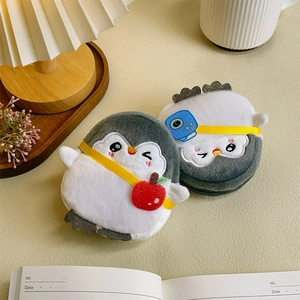 Cute grey penguin plush coin purse with a red apple and blue camera crossbody strap
