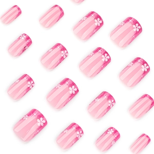 French rose pink glitter press-on nails with white flower patterns in a short square shape