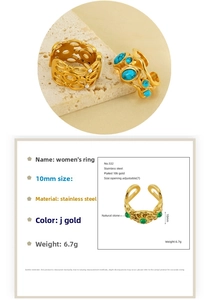 Detail shot of 10mm wide vintage 18k gold plated stainless steel ring with green stone