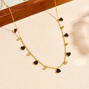 Elegant gold-plated necklace with black heart pendants and sparkling zircon accents