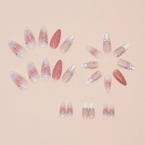 Pink and white gradient press-on nails with silver bow and star designs, 24 piece set