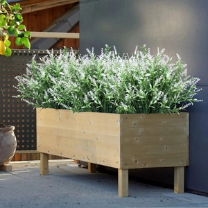 Artificial white lavender flowers in a wooden planter box for outdoor balcony decor