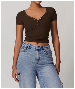 Close-up of V-neck Henley shirt featuring metallic buttons and breathable brushed fabric