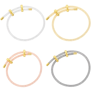 Detailed macro view of multi-color adjustable metal mesh tube bracelets with gold sliders