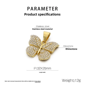 Macro detail of a 32x25mm gold butterfly pendant made of stainless steel with rhinestones