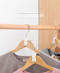 Space-saving white plastic hanger connector hooks showing stackable vertical storage