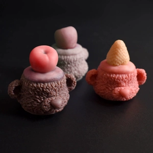 Macro detail of teddy bear silicone molds with realistic fur textures and fruit accents