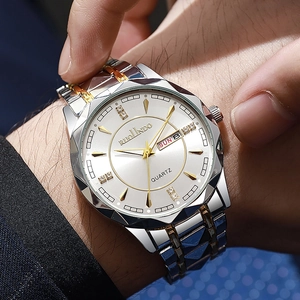 Close-up of RUOLINDO quartz watch with white dial, golden hands, and double calendar