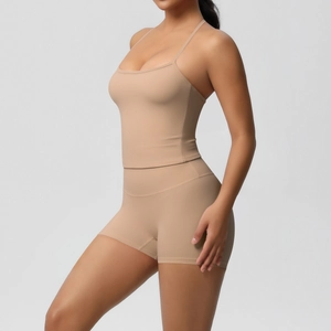 Macro detail of nude yoga set fabric and stitching on crop top and high waist shorts