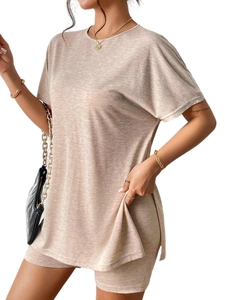 Detail of oat-beige casual knit set featuring side slit t-shirt and slim shorts