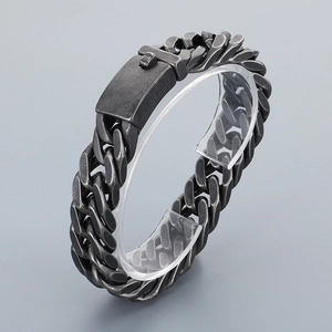 Detail of vintage silver titanium steel Cuban chain bracelet with rectangular clasp closure