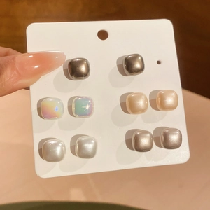 Detailed set of geometric square stud earrings in various metallic and pearlescent finishes