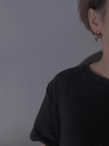 Minimalist metallic waterdrop earrings shown on model for elegant daily styling