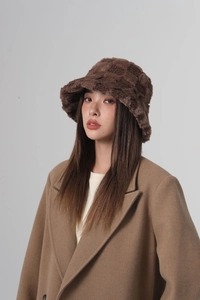 Detailed view of dark brown checkerboard pattern on plush faux fur bucket hat fabric