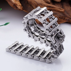 Detailed macro view of the dragon head clasp on a silver stainless steel dragon bone chain