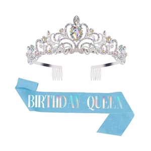 Silver rhinestone birthday crown with blue Birthday Queen sash set on white background