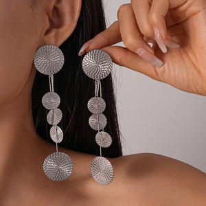 Detailed view of silver multi-layer geometric circle tassel earrings with mesh texture