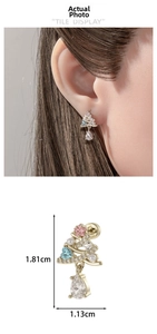 Detail of Christmas tree stud earring with colorful stones and a pear-shaped zircon drop