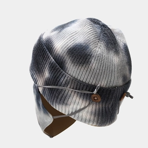 Winter tie-dye knit beanie with ear flaps and matching face mask set in blue and grey