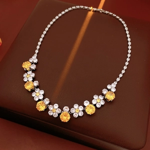 Close-up of luxury flower necklace with yellow and white zircon stones on jewelry box