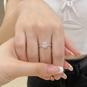 Close-up of S925 silver ring with rectangular ice-cut zircon on female hand