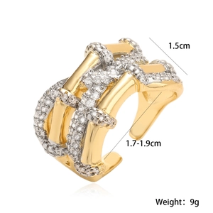 Detail view of two-tone geometric open ring with dimensions 1.5cm width and 9g weight