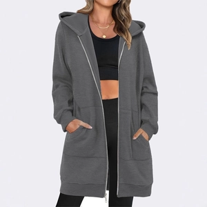 Detail of dark gray longline hoodie with front pockets and premium metal zipper closure