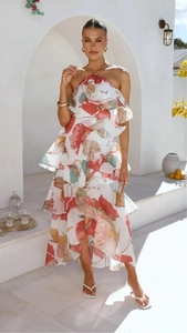 Detail of multi-layered ruffle chiffon dress with vibrant tropical floral print