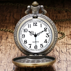 Close-up of vintage bronze locomotive pocket watch with white dial and quartz movement