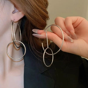Minimalist double interlocking silver hoop earrings with high-polish metallic finish