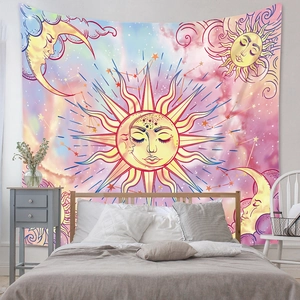 Detail of pink and blue gradient tapestry with sun and moon pattern as bed headboard decor