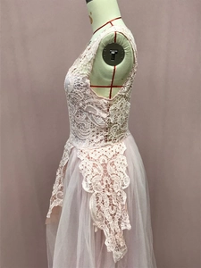 Detailed close-up of pink lace bodice and multi-layer tulle skirt on a mannequin