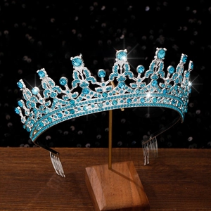 Macro shot of silver bridal crown with light blue rhinestones and side hair combs