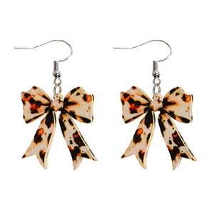 Macro shot of leopard print bow earrings made of glossy acrylic with silver metal hooks