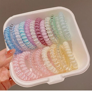 Close-up of colorful spiral telephone wire hair ties in various candy pastel shades