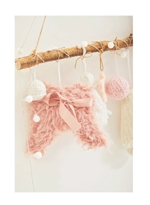 Pink plush angel wing decoration with satin bow and warm white LED string lights