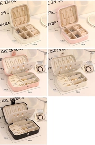 Detail view of large jewelry organizer with adjustable dividers and necklace hooks