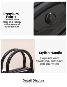 Detailed macro view of the glossy black PVC jelly bag featuring a round buckle and dual handles