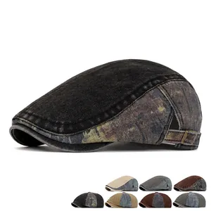 Washed patchwork denim newsboy cap in vintage camo and black canvas with metal buckle