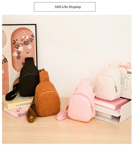 Detail view of mini plush crossbody bags in four colors arranged on a wooden desk