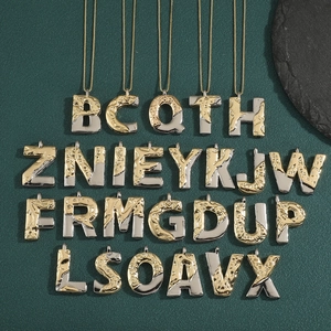Two-tone alphabet letter pendant necklaces with unique lava textured gold and silver finish